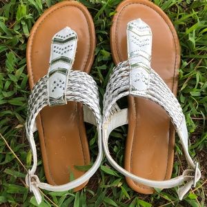 Brown sandals with white straps and jewels